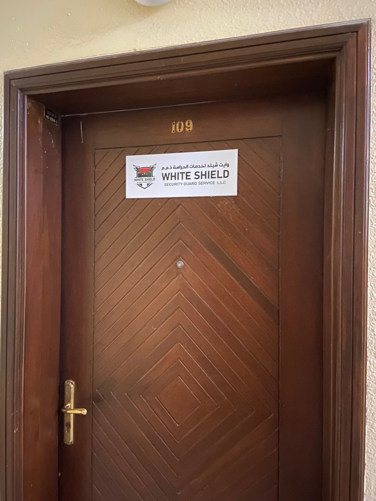 HiDubai-business-white-shield-security-guard-service-b2b-services-safety-security-naif-dubai